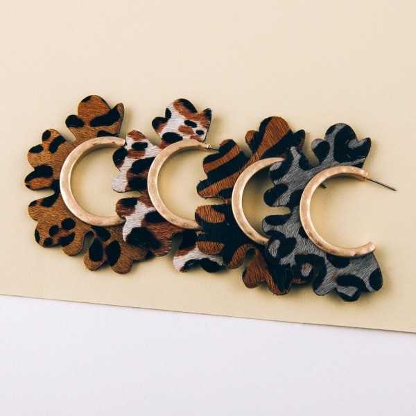 Genuine leather leopard print flower cut out hoop earrings.

- Approximately 2" in diameter