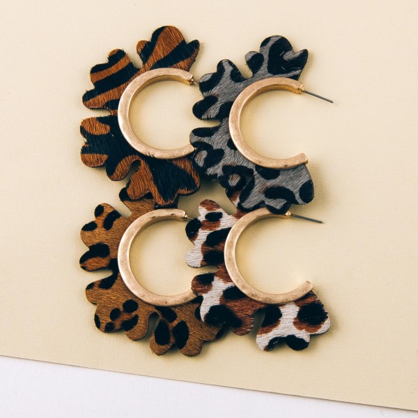 Genuine leather leopard print flower cut out hoop earrings.

- Approximately 2" in diameter