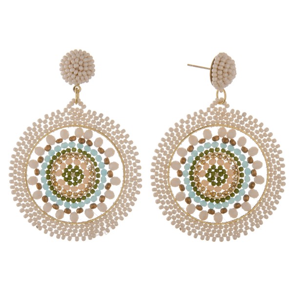 Seed beaded woven bohemian earrings with glass bead details.

- Approximately 2.5" in length and 2" in diameter
