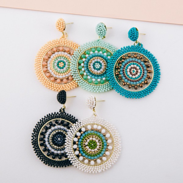 Seed beaded woven bohemian earrings with glass bead details.

- Approximately 2.5" in length and 2" in diameter