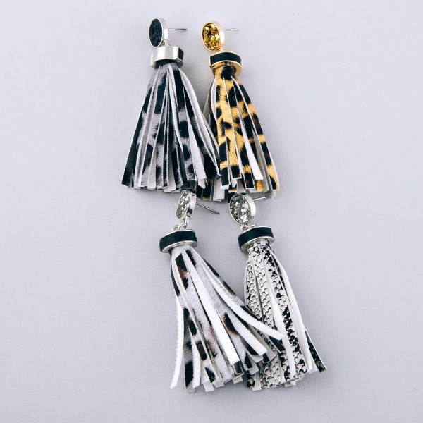 Faux leather leopard print tassel earrings with glitter stud accent.

- Approximately 3" in length