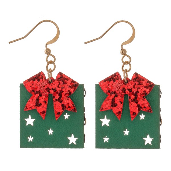 Two Tone Glitter Christmas Present Drop Earrings Featuring Star Punch Out Details.

- Faux Leather 
- Approximately 1.5" L 