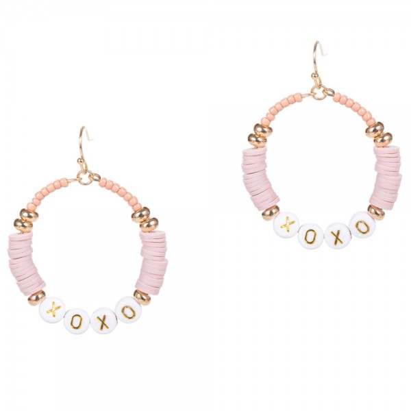 Drop Earrings Featuring Heishi Bead Accents and Letter Beads that Say "XOXO". 

- Approximately 2" Long 