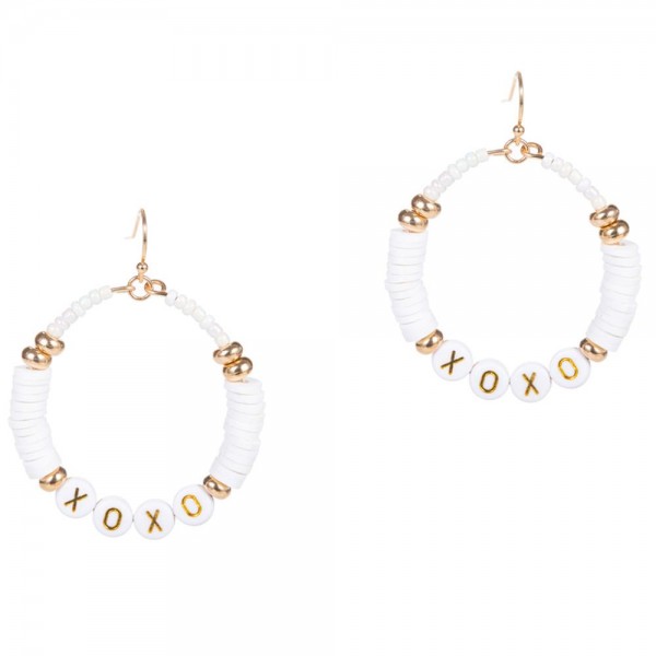 Drop Earrings Featuring Heishi Bead Accents and Letter Beads that Say "XOXO". 

- Approximately 2" Long 