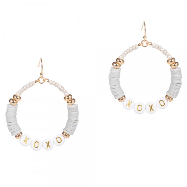 Drop Earrings Featuring Heishi Bead Accents and Letter Beads that Say "XOXO". 

- Approximately 2" Long 