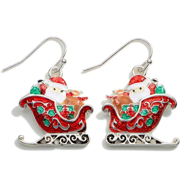 Santa in his Sled Drop Earrings. 

- Approximately 1.25" in Length