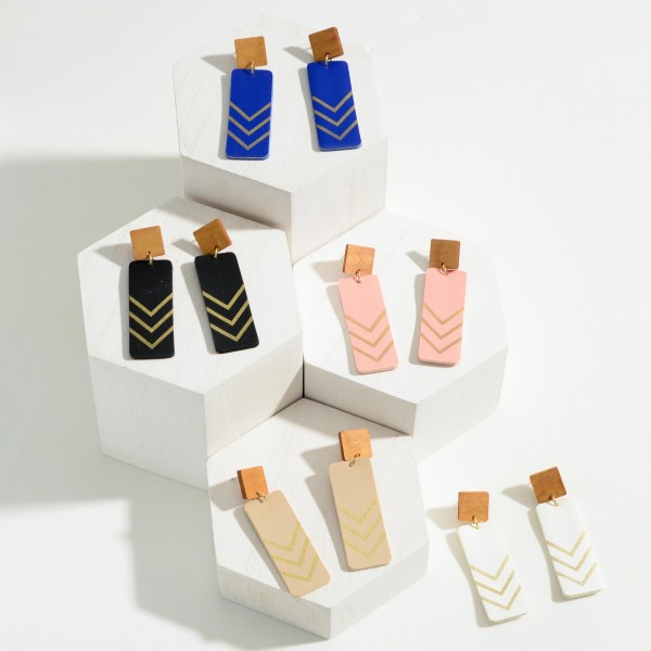 Statement Leather and Wood Drop Earrings Featuring Gold Tone Chevron Accent

- Approximately 2.5" Long