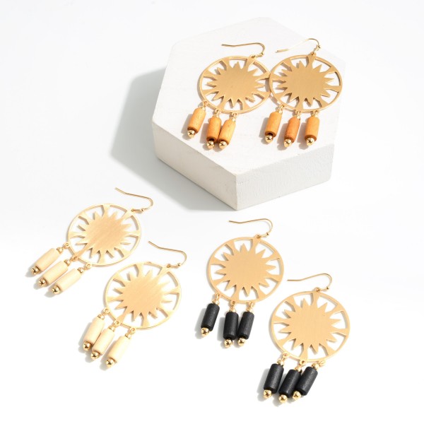 Gold Tone Circle Drop Earring Featuring Wood Beaded Tassels

- Approximately 2.5" L