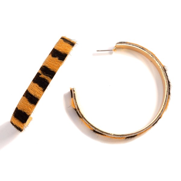 Animal Print Leather and Gold Tone Statement Hoop Earrings

- Approximately 2.25" Diameter