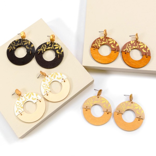 Gold Tone Metallic Filigree Print Leather and Wood Circle Drop Earrings

- Approximately 2.25" L