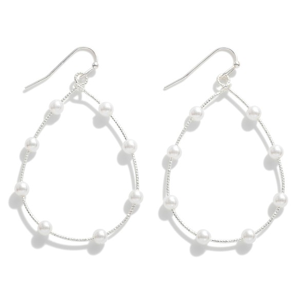 Metal Teardrop Drop Earrings Featuring Pearl Accents.

- Approximately 2" L