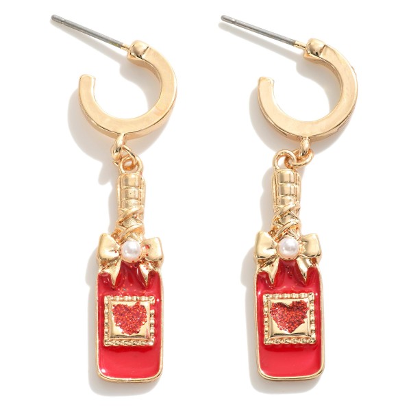 Huggie Hoop Earrings Featuring Enamel Heart Champagne Bottle Charms

- Approximately 1.75" L