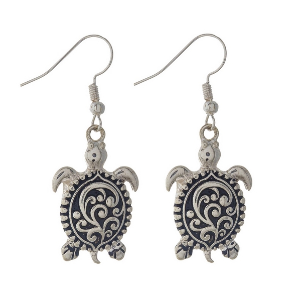 Silver sea turtle earrings featuring a filigree design. Approximately 1 1/4" in length.