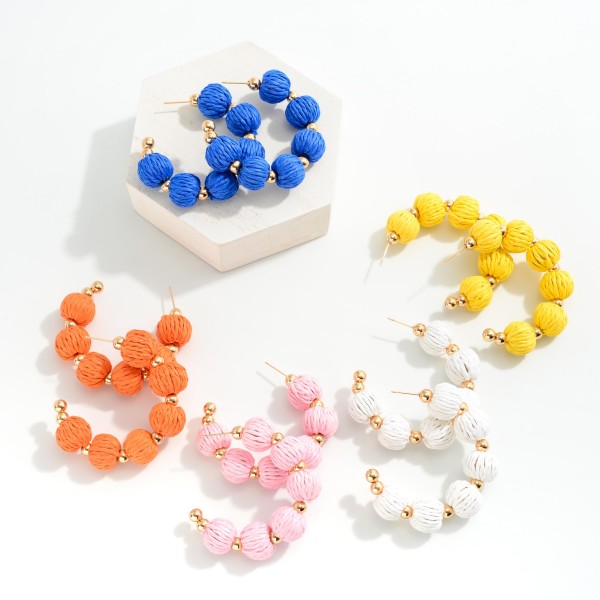 Raffia Bead Drop Hoop Earrings With Gold Tone Accents

- Approximately 2" L