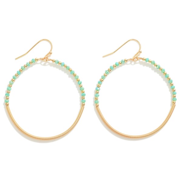 Circular Beaded Drop Earring With Faceted Beaded Detail

- Approximately 2" L