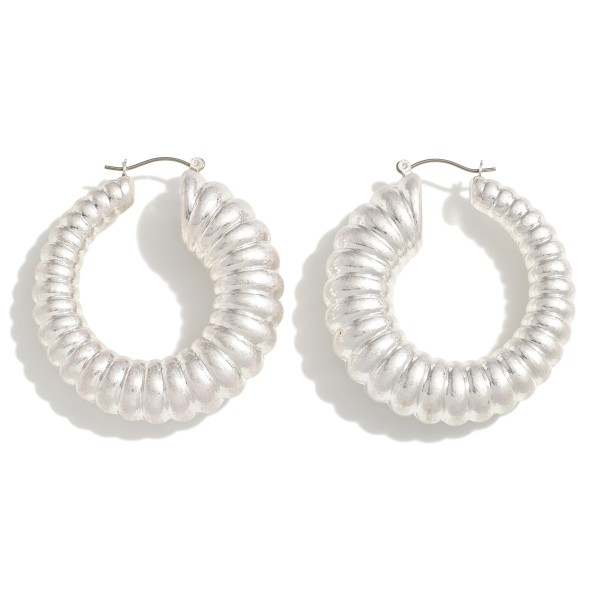 Metal Telephone Cord Drop Hoop Earrings

- Approximately 2" L
- Hypoallergenic Titanium Post 