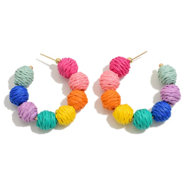 Circular Raffia Wrapped Beaded Drop Hoop

- Approximately 1.75" L 