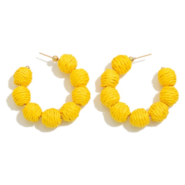 Circular Raffia Wrapped Beaded Drop Hoop

- Approximately 1.75" L 