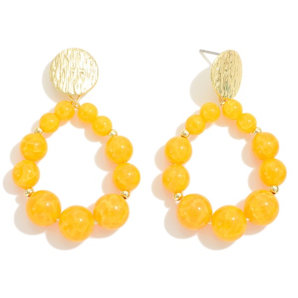 Natural Stone Beaded Drop Earrings Featuring Etched Gold Tone Disk Posts

- Approximately 2" L