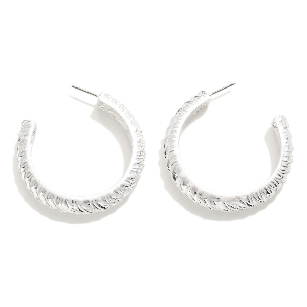 Twisted Metal Hoop Drop Earrings

- Approximately 1.75" L
- Hypoallergenic Titanium Post 