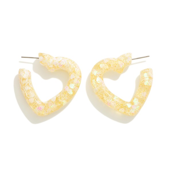 Glitter Accented Resin Hoop Earrings

- Approximately 1.25" L
- Hypoallergenic Titanium Post 