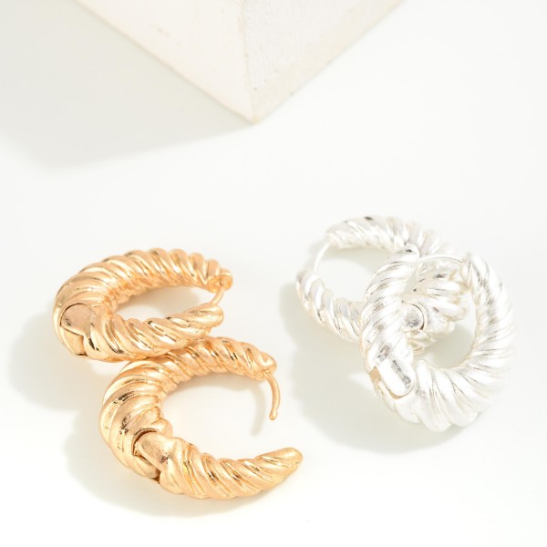 Metal Hinged Croissant Huggie Hoop Earring

- Approximately 0.75" L 