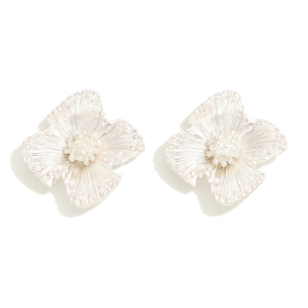 Metal Tone Flower Stud Earrings With Pearl Border Detail

- Approximately 1" W