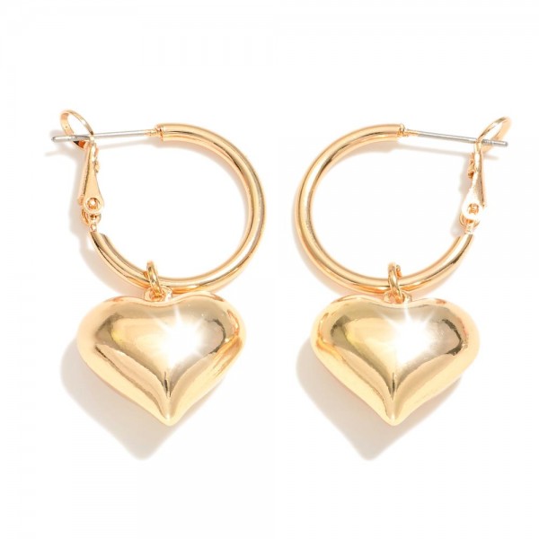 Gold Tone Hoop Earrings Featuring Heart Charm 

- Approximately 1.5" L
- Hoop .75" D