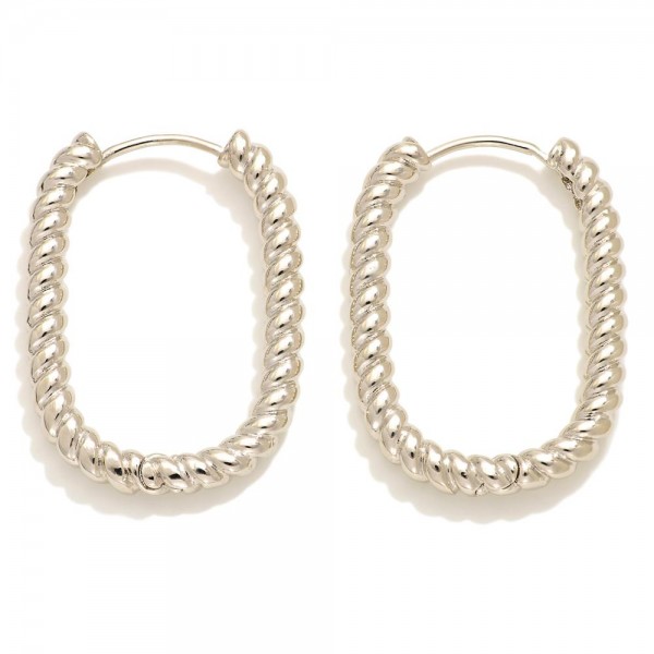 Do Everything In Love Twisted Metal Rounded Rectangle Hoop Earrings

- Brass Base
- Hypoallergenic
- White / 14K Gold Dipped
- Made In Korea
- Approximately .75" D