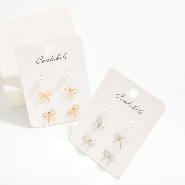 Set of Three Stud Earrings Featuring Metal Bows and Simple Pearl Studs
- Approximately .125" - .5" L