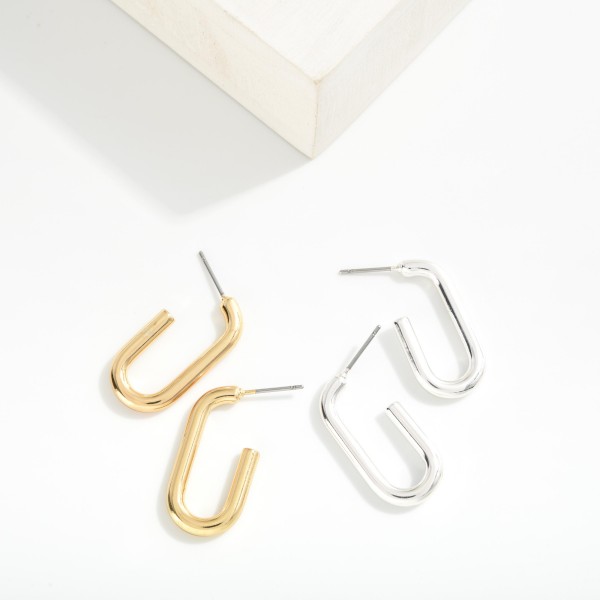 Metal Tone Elongated Hoop Earrings
- Approximately 1" L
- Brass Base