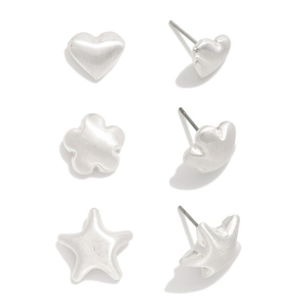 Set Of Three Metal Tone Stud Earrings Featuring Heart, Flower, & Star

- Approximately .75" L