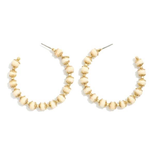 Wood Beaded Hoop Earrings With Gold Tone Details 

- Approximately 2" D