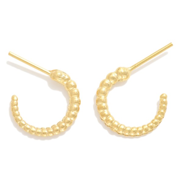 Twisted Metal Hoop Earrings

- Approximately .5" L
- 18k Gold Filled
- Hypoallergenic
- Made In Brazil