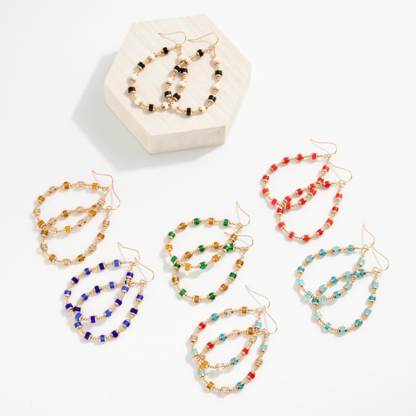 Beaded Teardrop Drop Earrings Featuring Metal Tones & Translucent Disc Beads
- Approximately 2.5" L