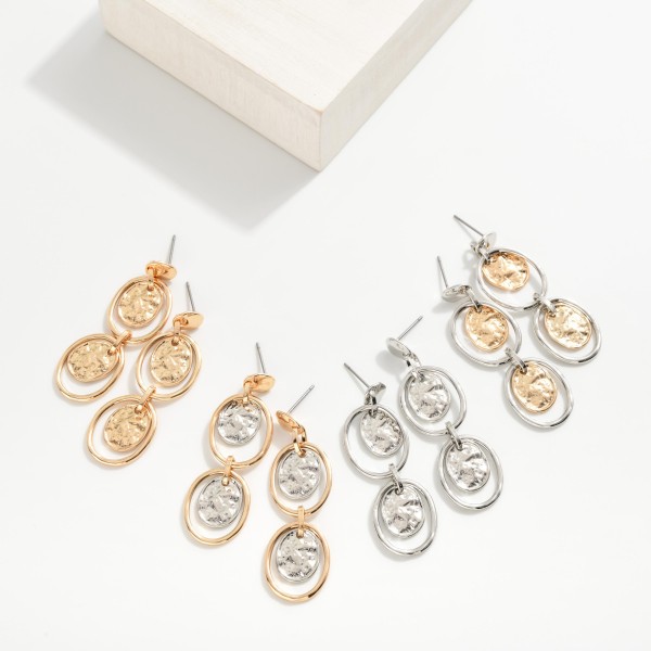 Linked Metal Tone Hoop Post Drop Earrings With Nesting Hammered Metal Oval Accent
- Approximately 2" L