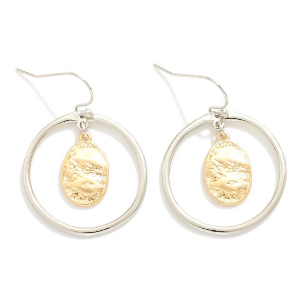 Metal Tone Hoop Drop Earrings Featuring Nesting Textured Metal Oval Detail 

- Approximately 1.5" L