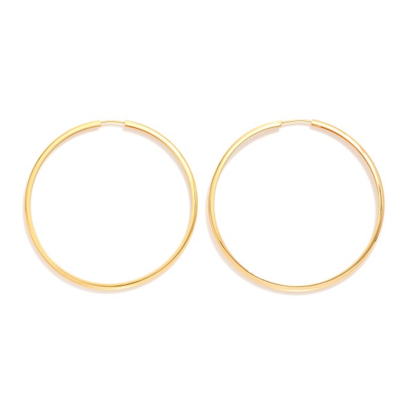 Metal Tone Endless Hoop Earrings 

- Approximately 2" D
- 18k Gold Filled
- Hypoallergenic
- Made In Brazil