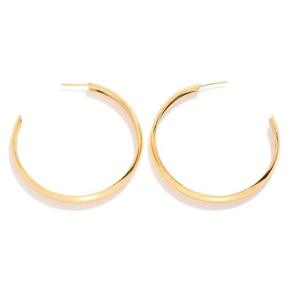 Large Metal Tone Flat Hoop Earrings 

- Approximately 2" D
- 18k Gold Filled
- Hypoallergenic
- Made In Brazil