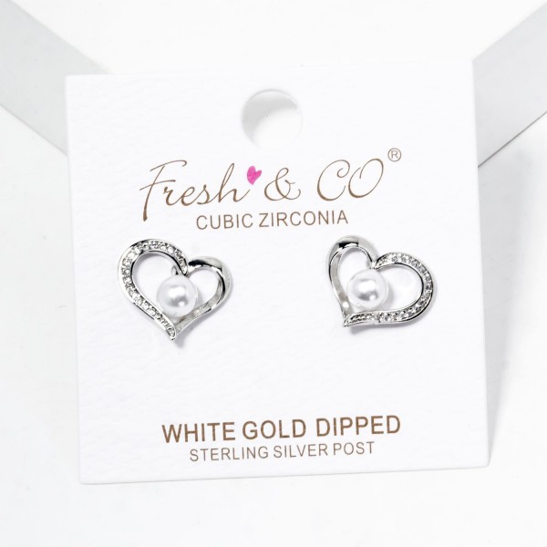 Hollow Metal Tone Heart Stud Earrings Featuring Pearl & Cubic Zirconia Details

- Gold Dipped
- Approximately .5" L