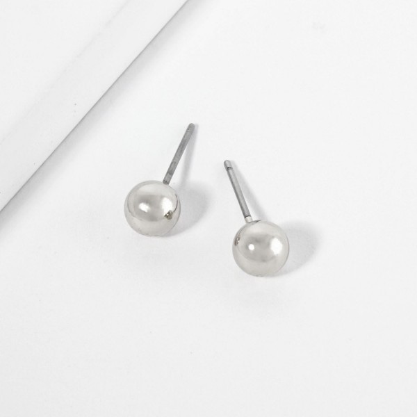 Metal Tone Ball Stud Earrings

- Approximately .25" L