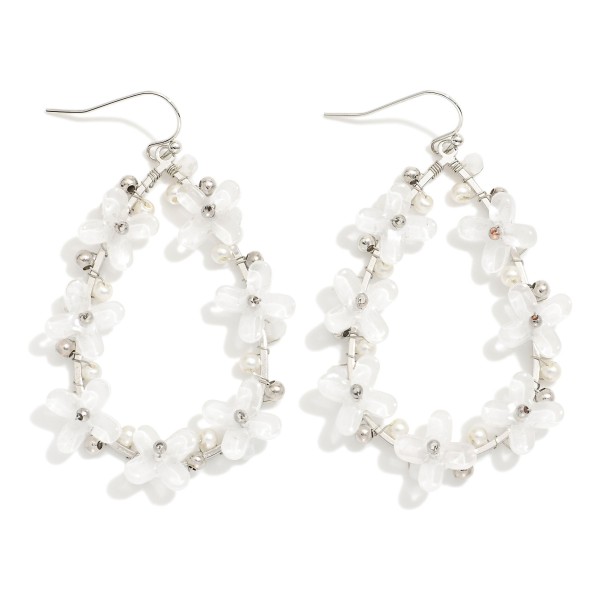 Metal Tone Teardrop Earrings Featuring Acetate Plus Cross Details 

- Approximately 2.25" L