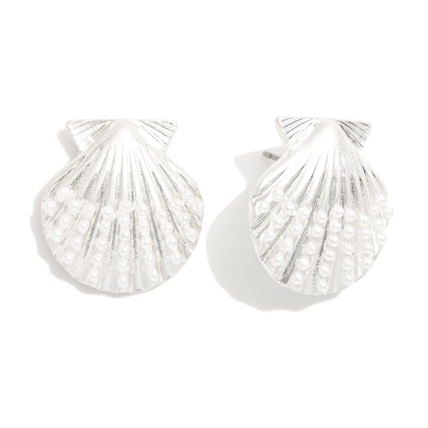 Metal Tone Shell Drop Earrings Featuring Pearl Details

- Approximately 1." L

