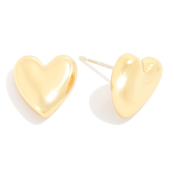 Puffy Metal Tone Heart Stud Earrings

- Approximately .5" L
- 18K Gold Dipped 
- Serling Silver Post 

