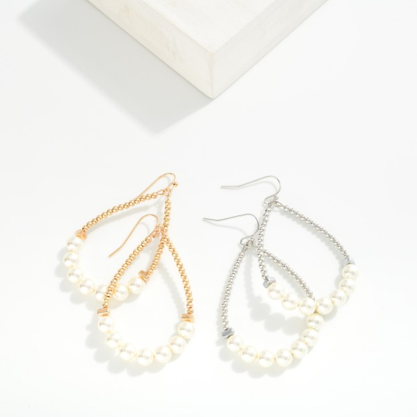 Metal Tone Bead Beaded Teardrop Earrings Featuring Pearl Detail

- Approximately 2" L

