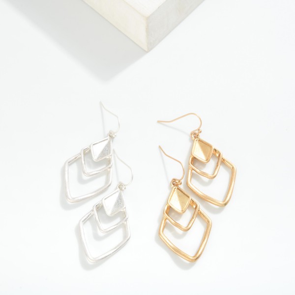 Metal Tone Earrings Featuring Layered Diamond Shaped Drop Earrings 

- Approximately 2" L 
