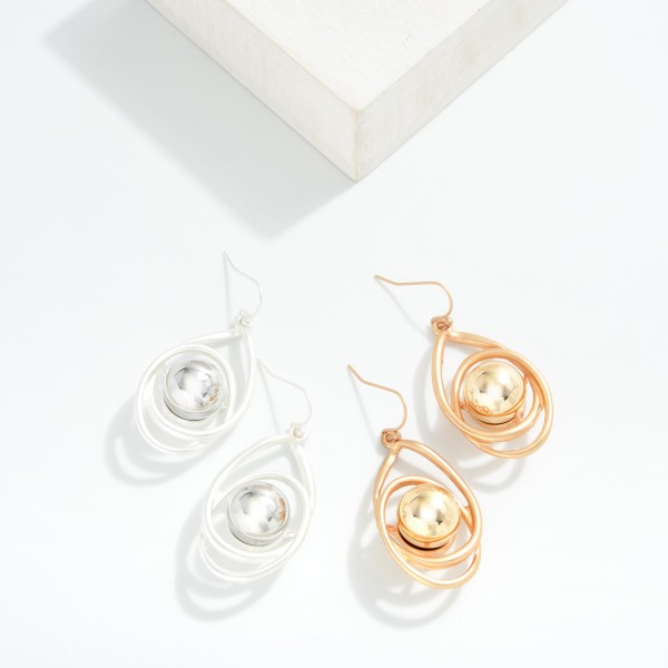 Intertwined Metal Oval Drop Earrings With Nesting Pearl Detail 

- Approximately 2" L 