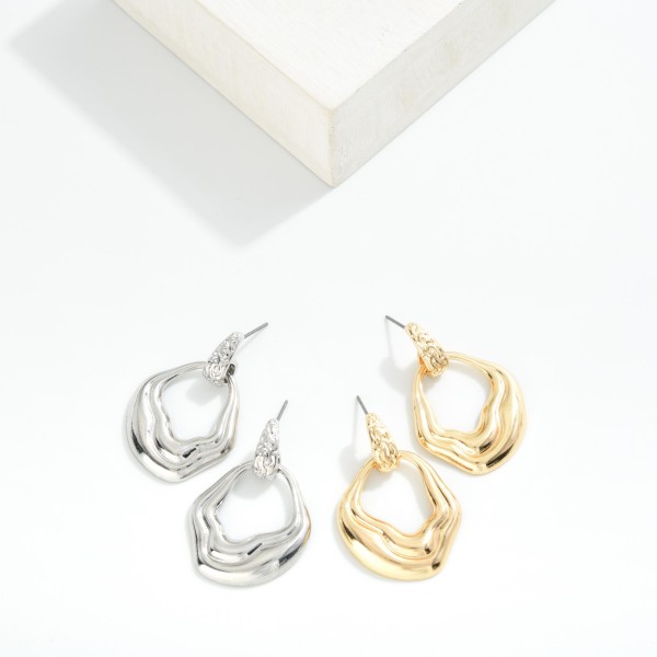 Metal ToneWavy Hoop Drop Earring With Textured Post 

- Approximately 1.5" L 