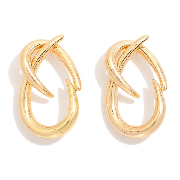 Metal Tone Twisted Hoops With A Modern Sculptural Design 

 - Approximately 1.5" L