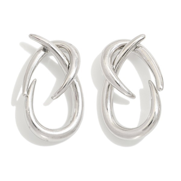Metal Tone Twisted Hoops With A Modern Sculptural Design 

 - Approximately 1.5" L